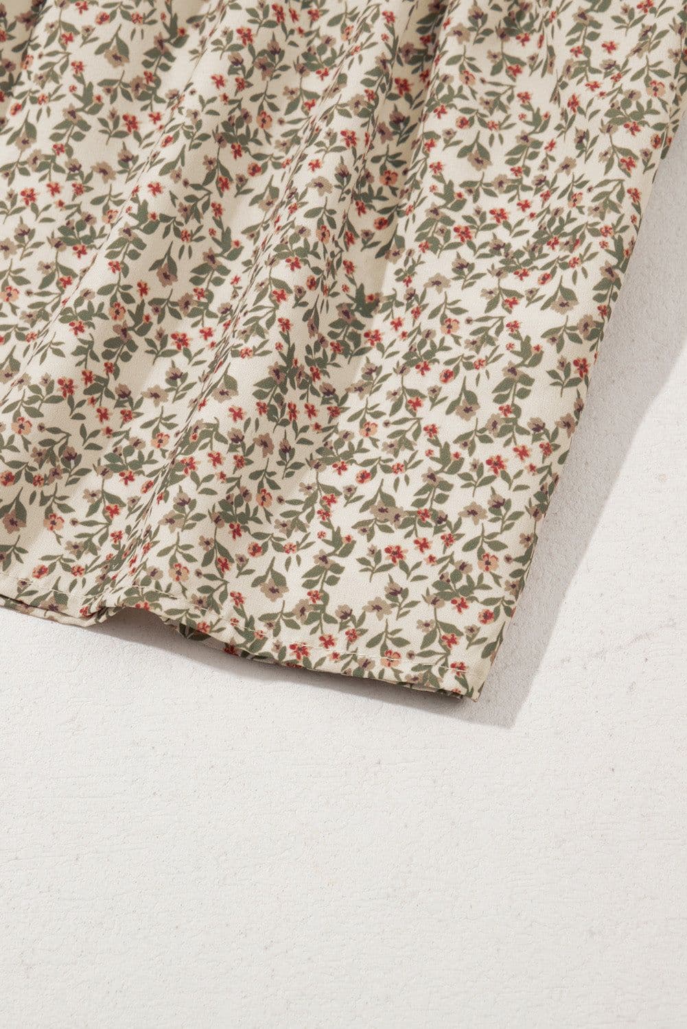 image-Floral Print Puff Sleeve Smocked Top with Peplum Waist V-Neck