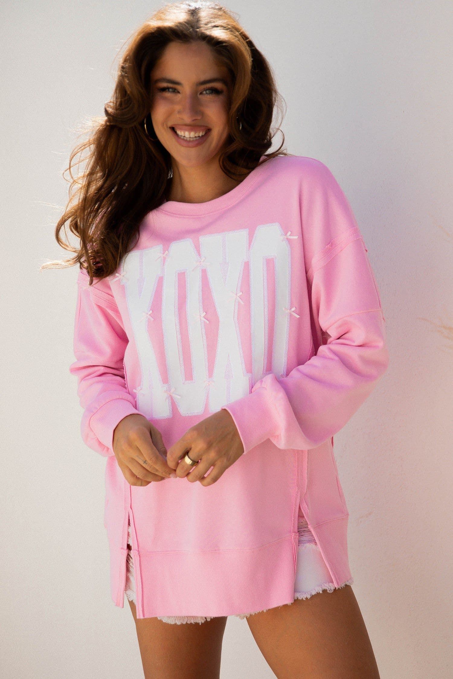 image-Pink Bow Sequin XOXO Letter Graphic Exposed Seam Baggy Sweatshirt