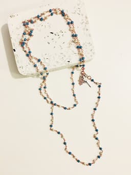 image-Rosary pearls and blu stones long necklace with magic wand and hamsa