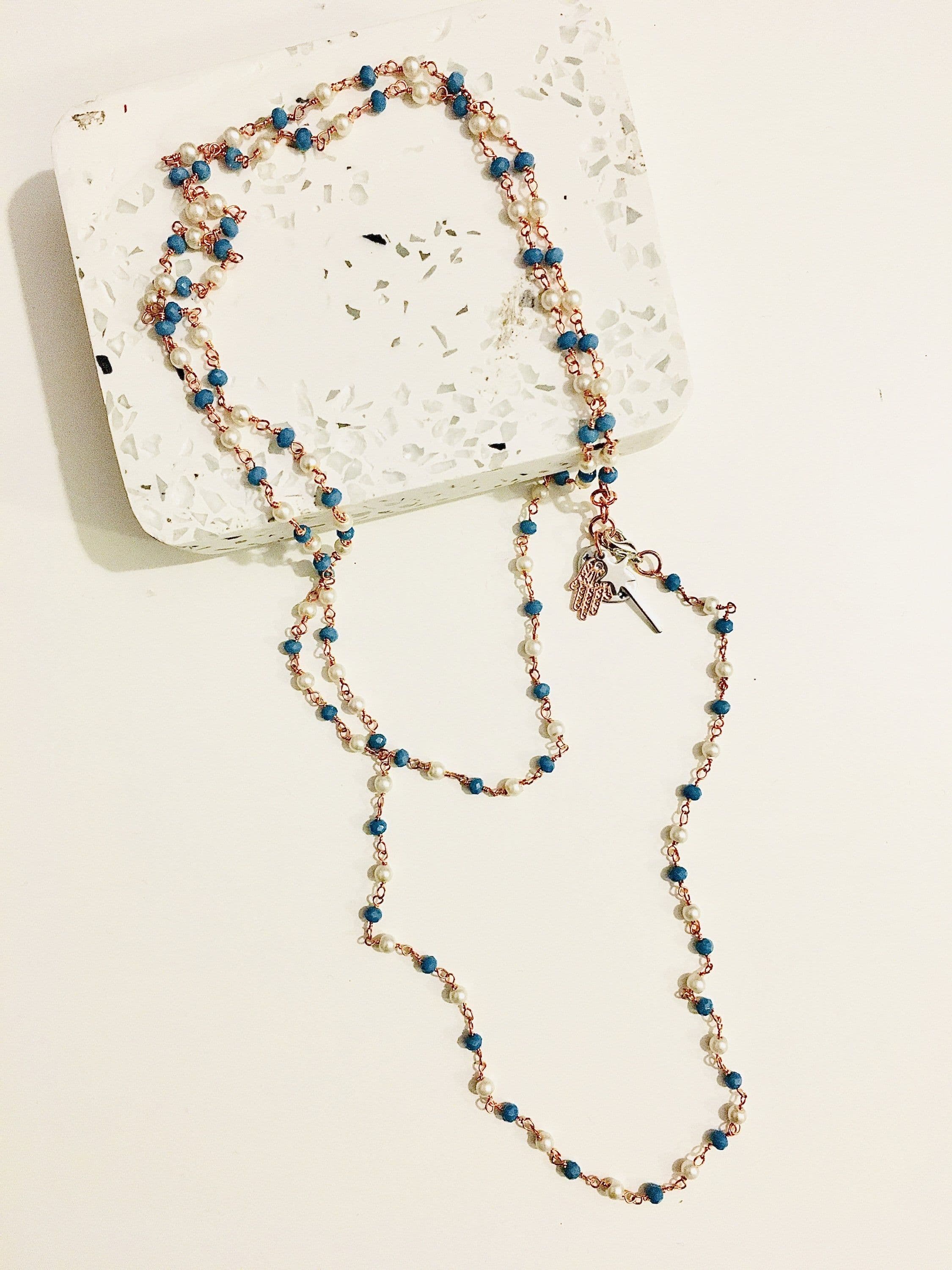 image-Rosary pearls and blu stones long necklace with magic wand and hamsa