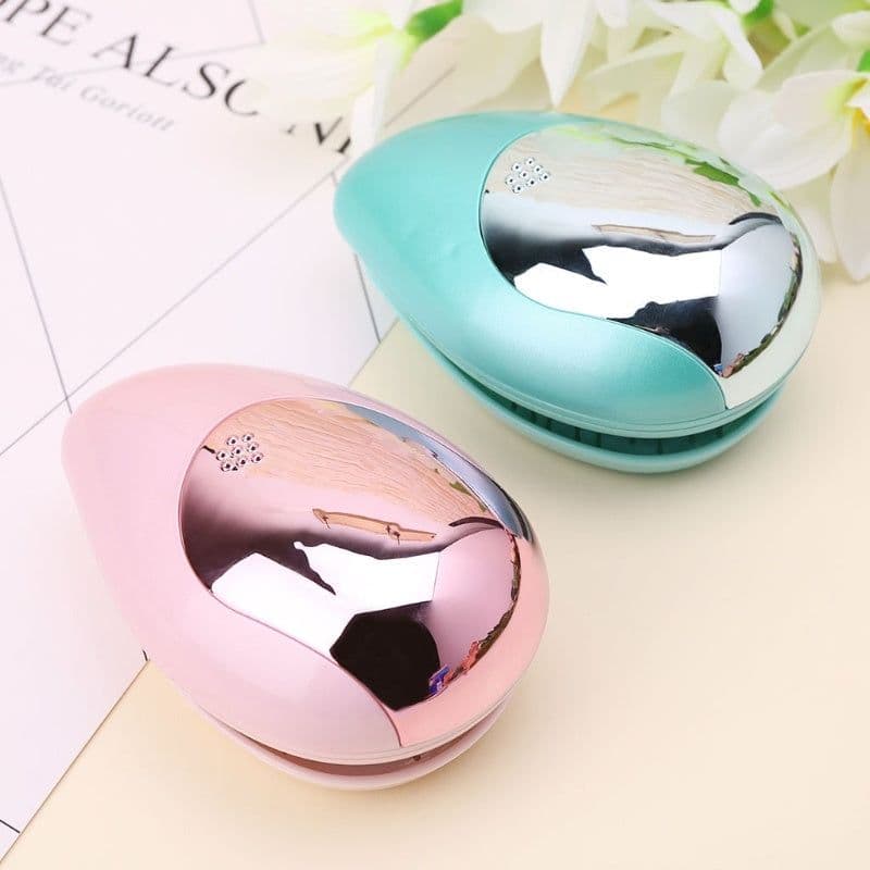 image-Electric Sound Wave Vibration Magnetic Massage Comb Portable Negative Ion Hair Comb