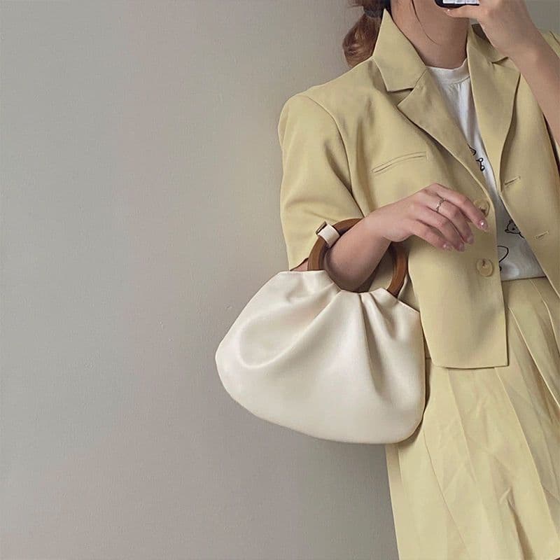 image-Wooden Handle Hand Holding Women's Shoulder Crossbody Wrinkled Bag