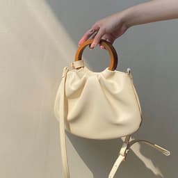 image-Wooden Handle Hand Holding Women's Shoulder Crossbody Wrinkled Bag