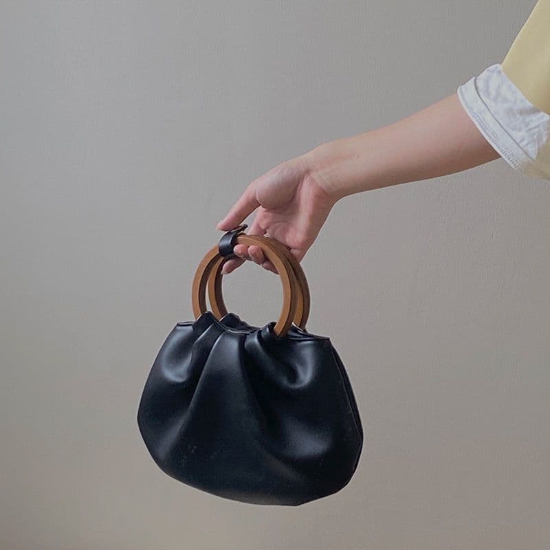image-Wooden Handle Hand Holding Women's Shoulder Crossbody Wrinkled Bag