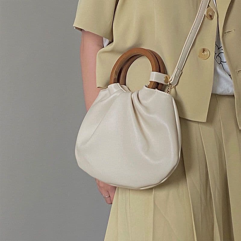 image-Wooden Handle Hand Holding Women's Shoulder Crossbody Wrinkled Bag