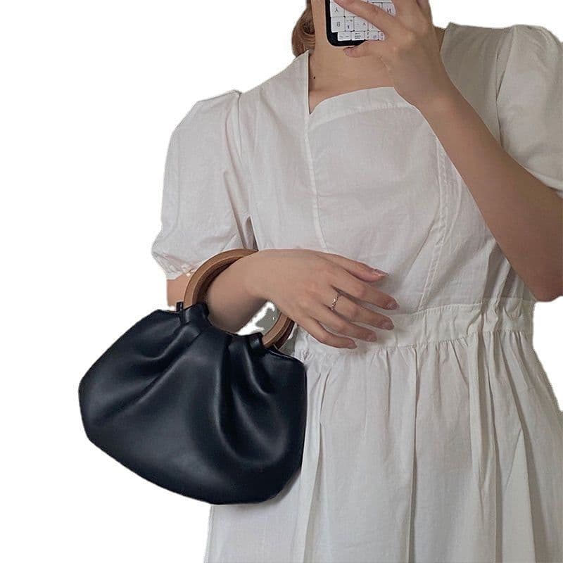 image-Wooden Handle Hand Holding Women's Shoulder Crossbody Wrinkled Bag