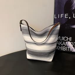 image-Artistic Striped Hand-carrying Bucket Bag For Women