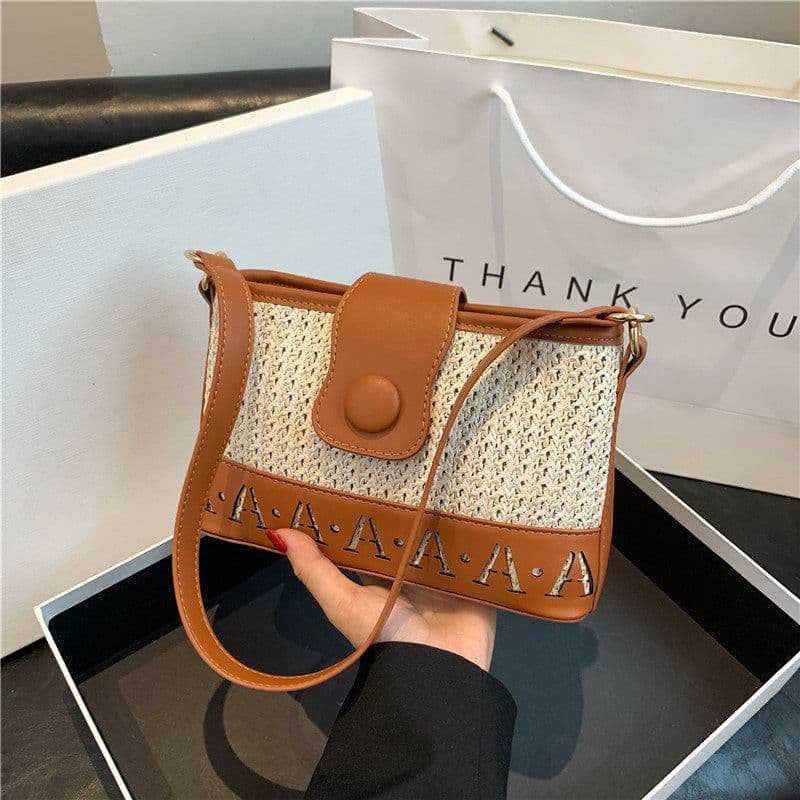 image-Summer Fashion Woven Female Niche Korean Style Advanced Texture Letters Hollow Shoulder Bag