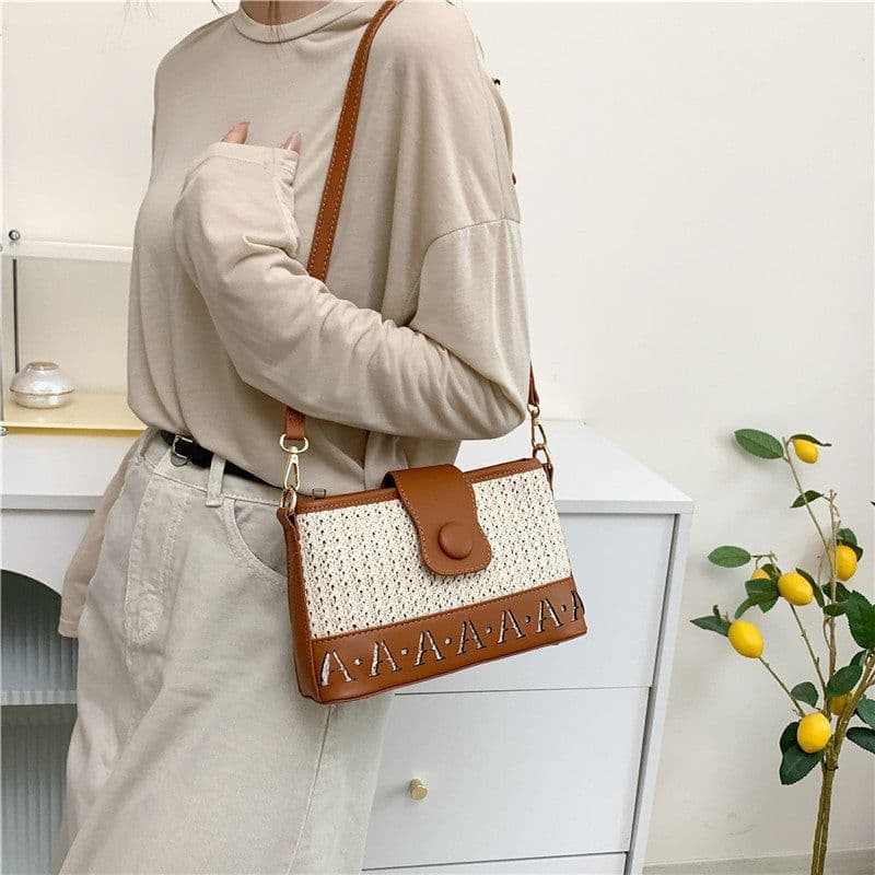image-Summer Fashion Woven Female Niche Korean Style Advanced Texture Letters Hollow Shoulder Bag