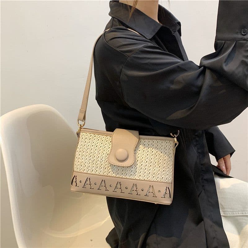 image-Summer Fashion Woven Female Niche Korean Style Advanced Texture Letters Hollow Shoulder Bag