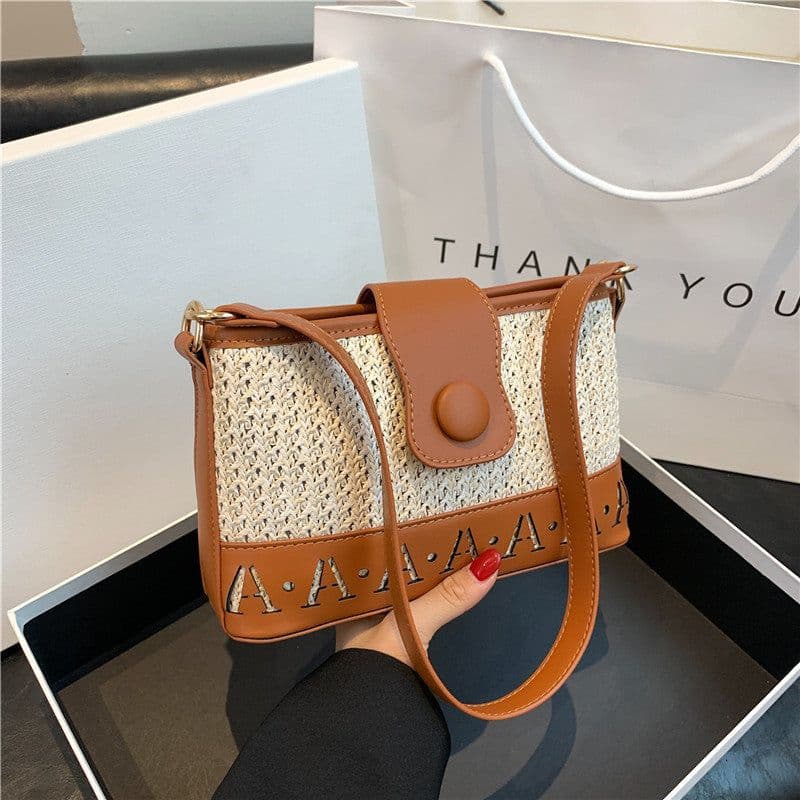 image-Summer Fashion Woven Female Niche Korean Style Advanced Texture Letters Hollow Shoulder Bag