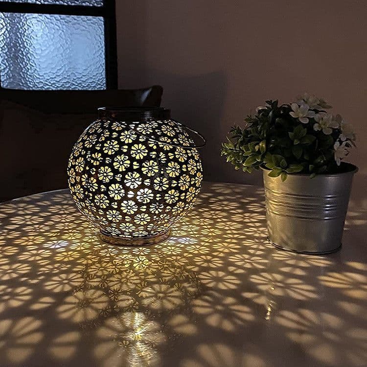 image-Solar Iron Hollow Flower Projection Lamp Outdoor Lawn Decorations