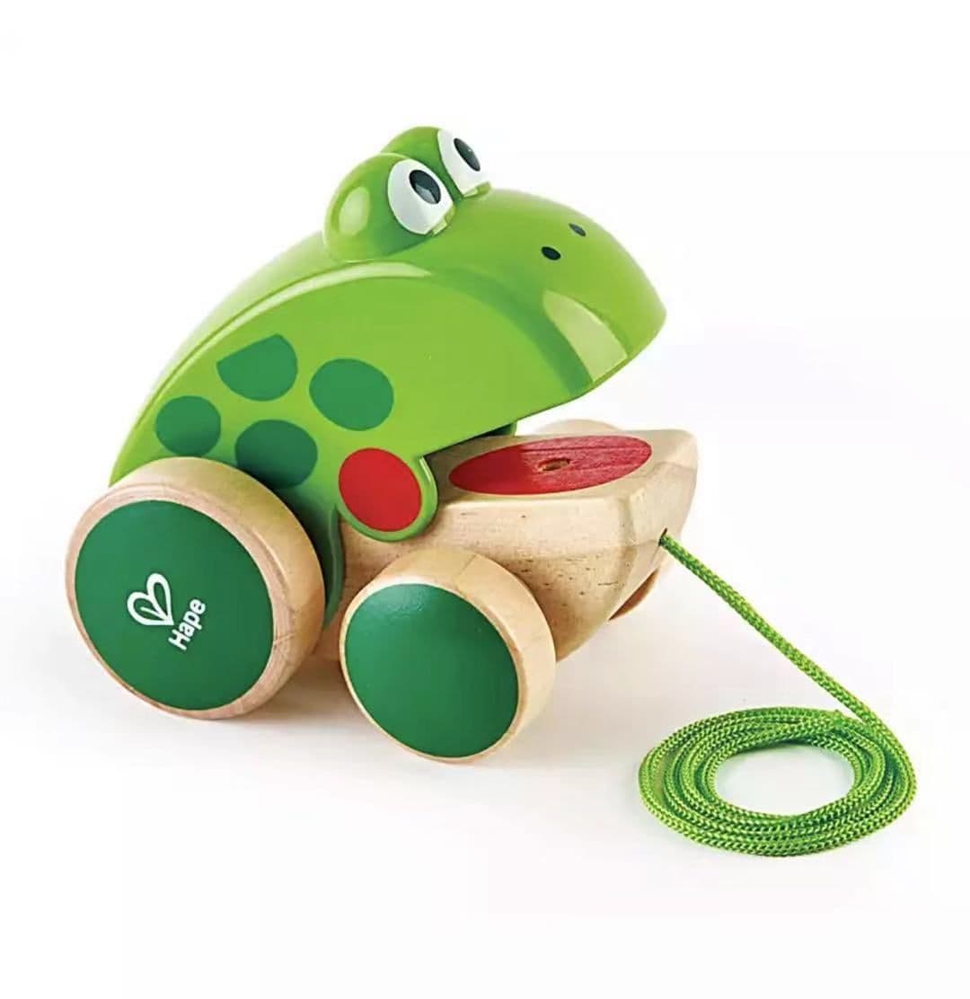 image-Frog dragging toddler hand-drawn toys