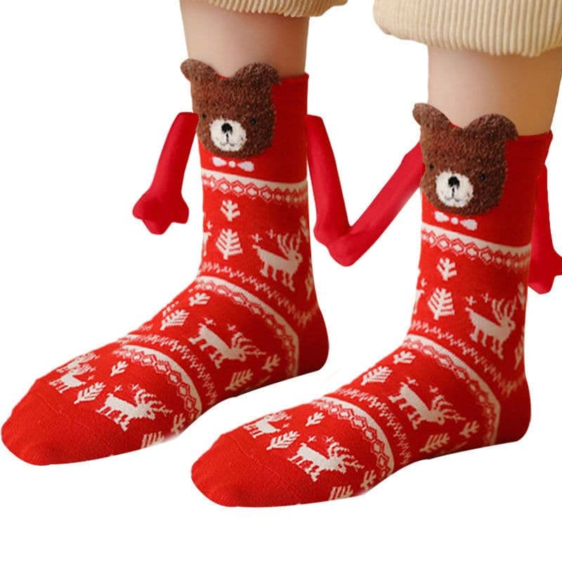 image-Hand Holding Couple Magnetic Handle Christmas Stockings