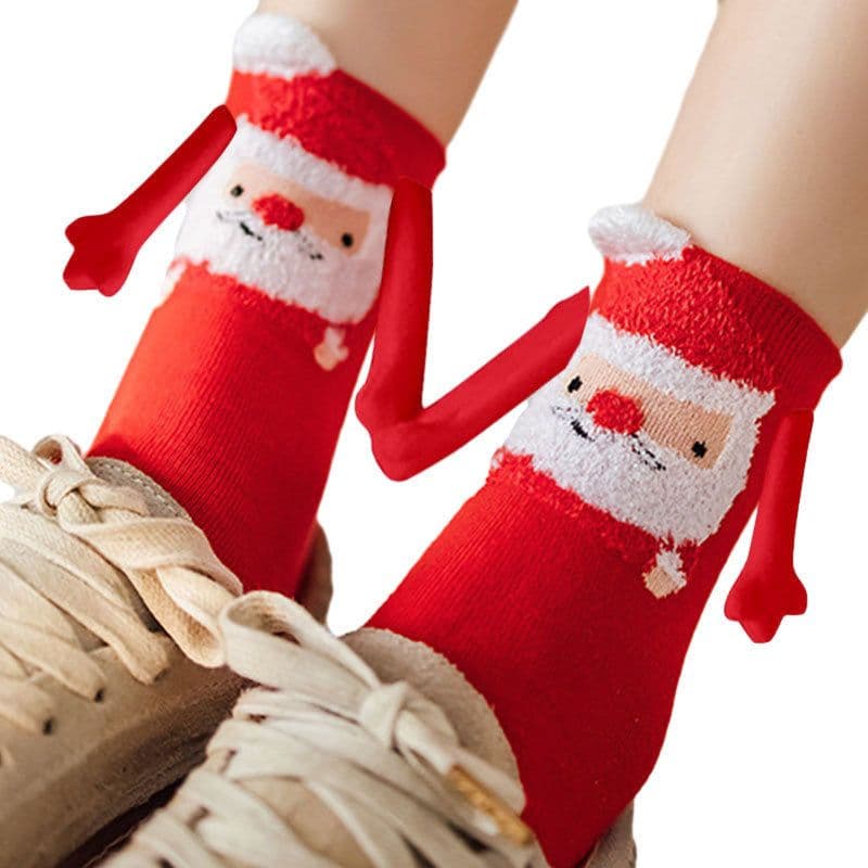 image-Hand Holding Couple Magnetic Handle Christmas Stockings