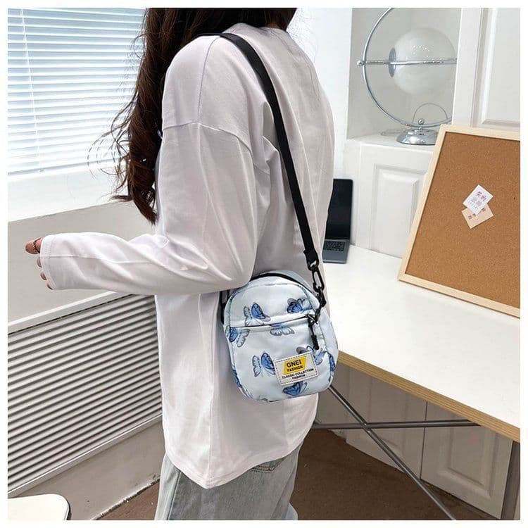 image-Spring And Summer Women's Bag Fashion Printed Nylon Fabric Travel Out Shoulder Crossbody