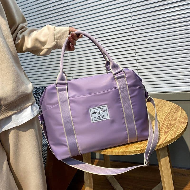 image-Portable Travel Bag Women's Large Capacity Lightweight Waterproof Luggage Bag