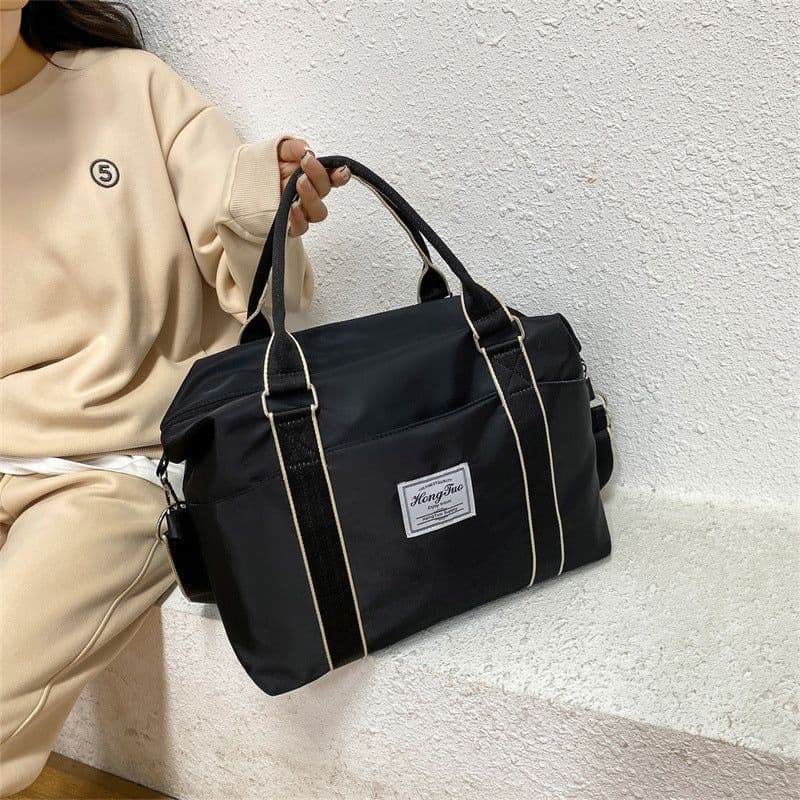 image-Portable Travel Bag Women's Large Capacity Lightweight Waterproof Luggage Bag