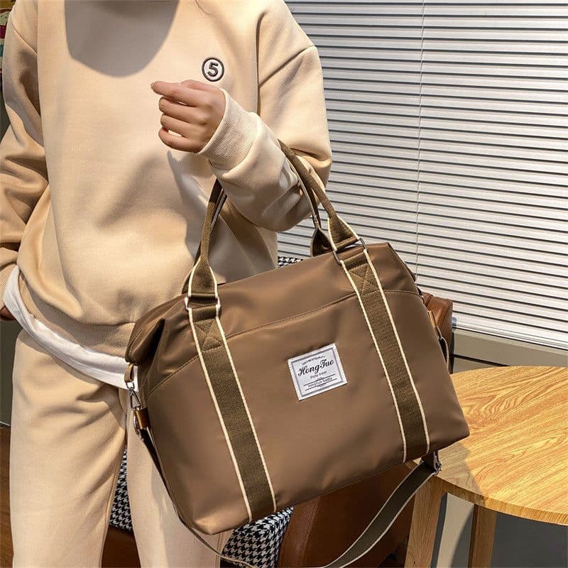 image-Portable Travel Bag Women's Large Capacity Lightweight Waterproof Luggage Bag
