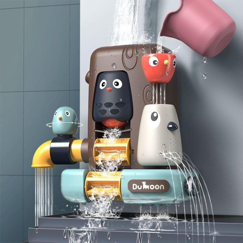 image-Baby Playing In The Water With A Shower Set