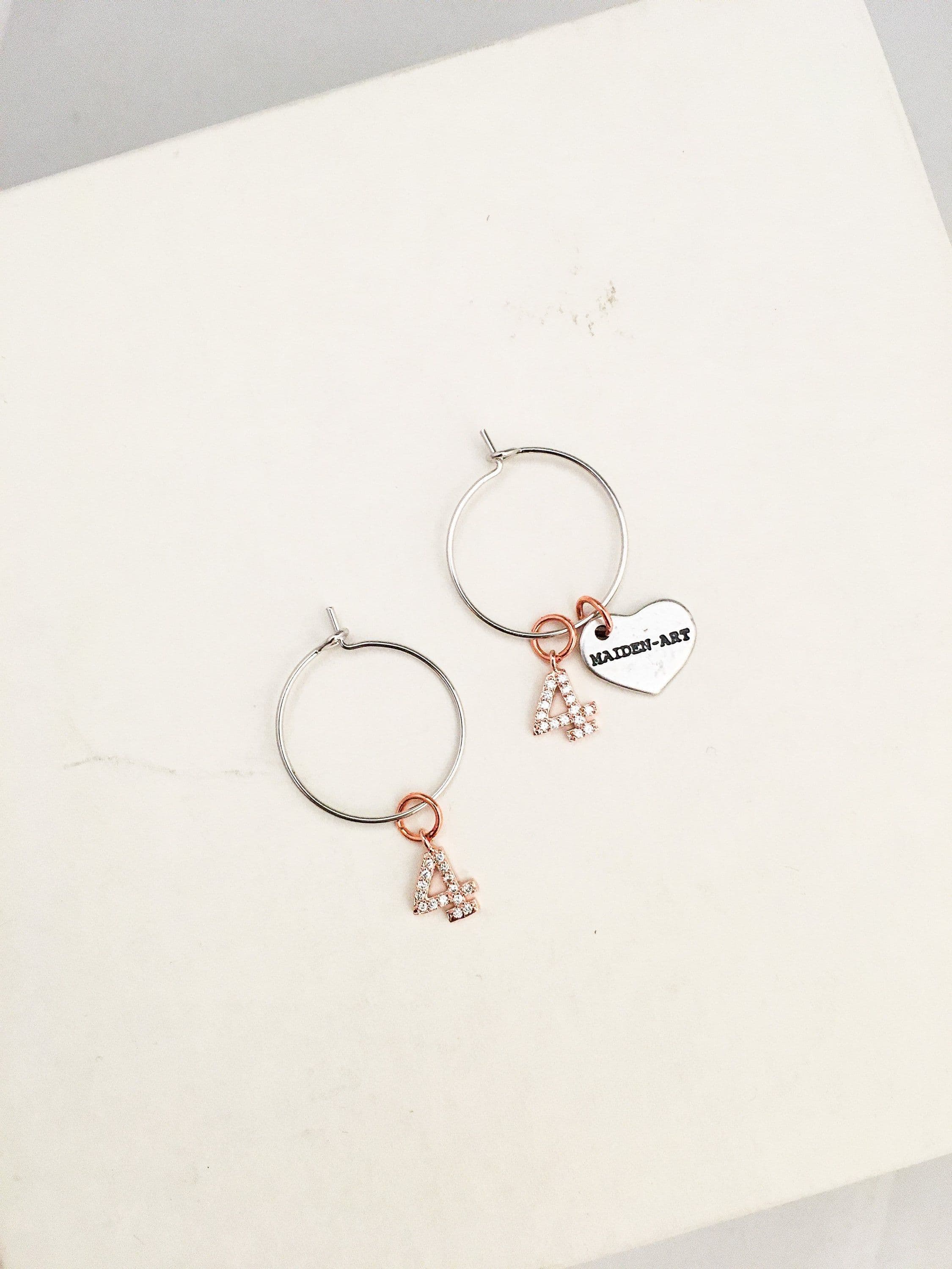 image-Number hoop earrings in silver, rose gold and rhinestones.