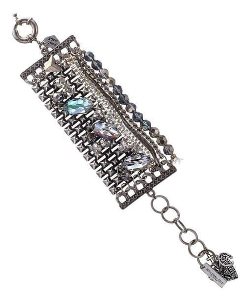 image-Banded bracelet features iridescent blue beads that dazzle in the