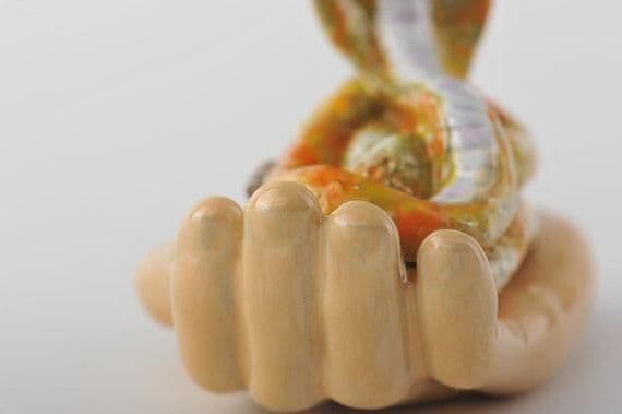 image-Zodiac Snake Laying on Hand