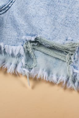 image-Light Blue Acid Wash Crossed Raw Edge Denim Shorts