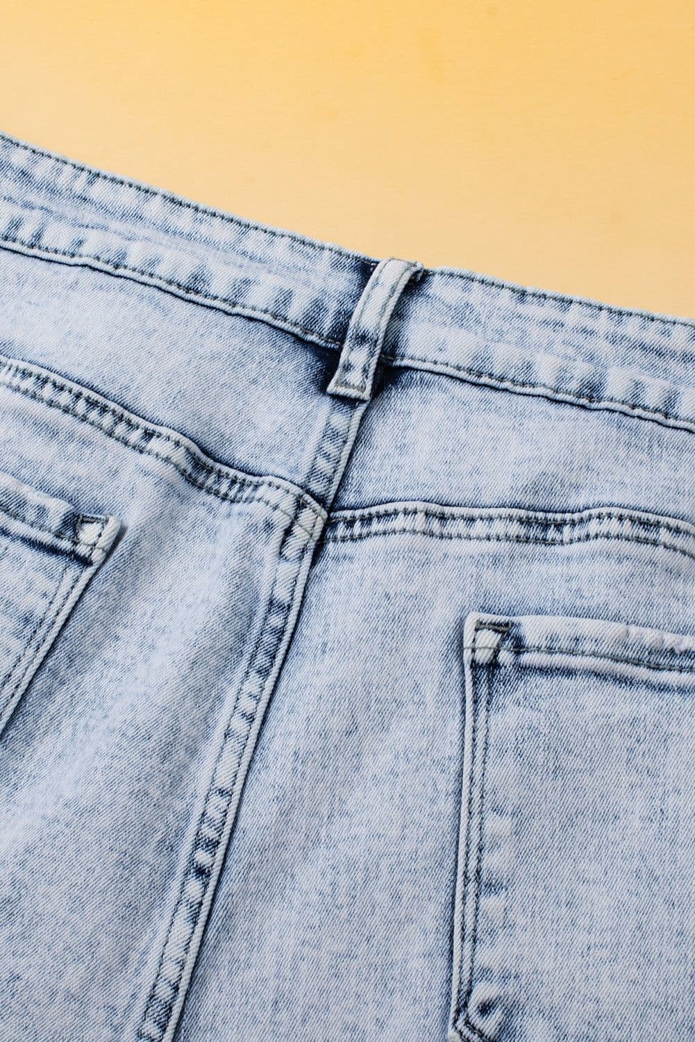 image-Light Blue Acid Wash Crossed Raw Edge Denim Shorts