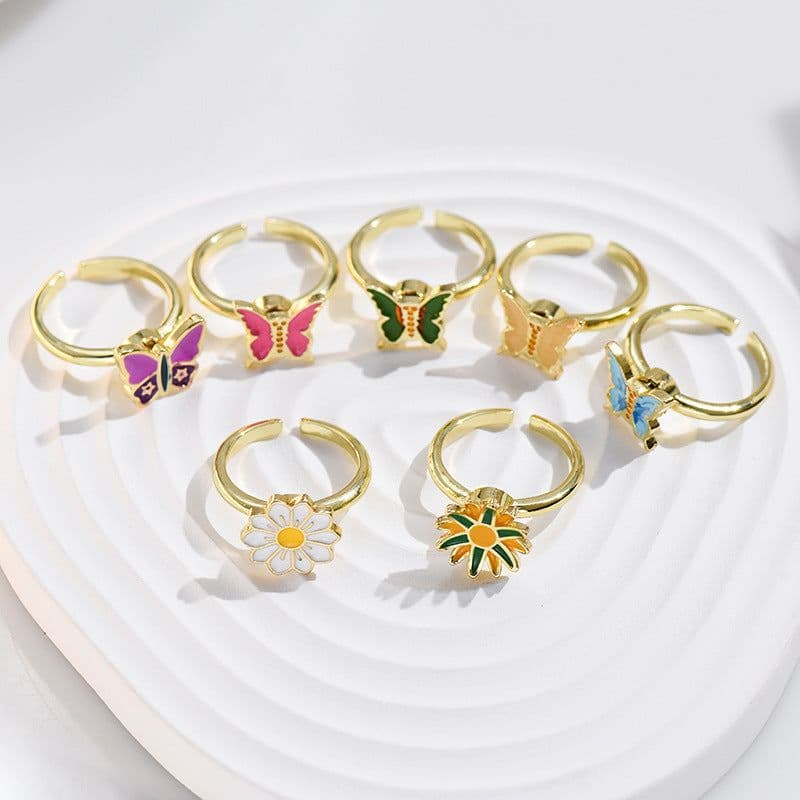 image-Adjustable Rotatable Five-Petal Flower Butterfly Ring - European Style