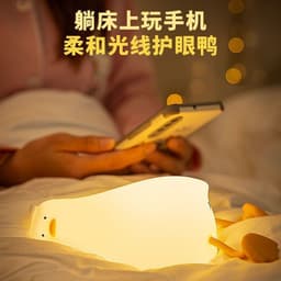 image-Lying Flat Turning Duck Night Light Fun Creative Silicone LED Night Light USB Charging Mobile Phone Holder Gift for Children