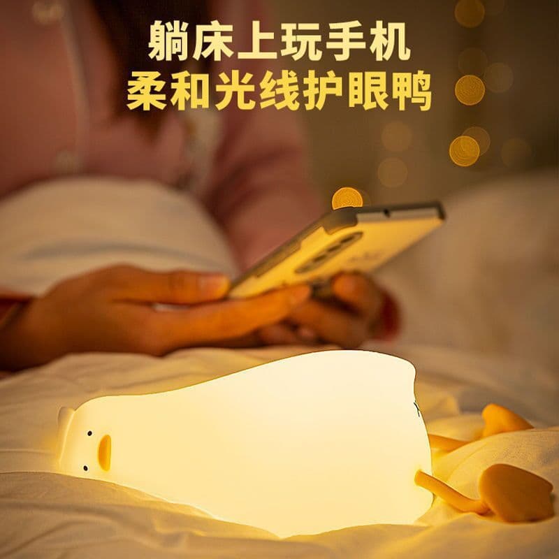 image-Lying Flat Turning Duck Night Light Fun Creative Silicone LED Night Light USB Charging Mobile Phone Holder Gift for Children