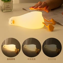 image-Lying Flat Turning Duck Night Light Fun Creative Silicone LED Night Light USB Charging Mobile Phone Holder Gift for Children