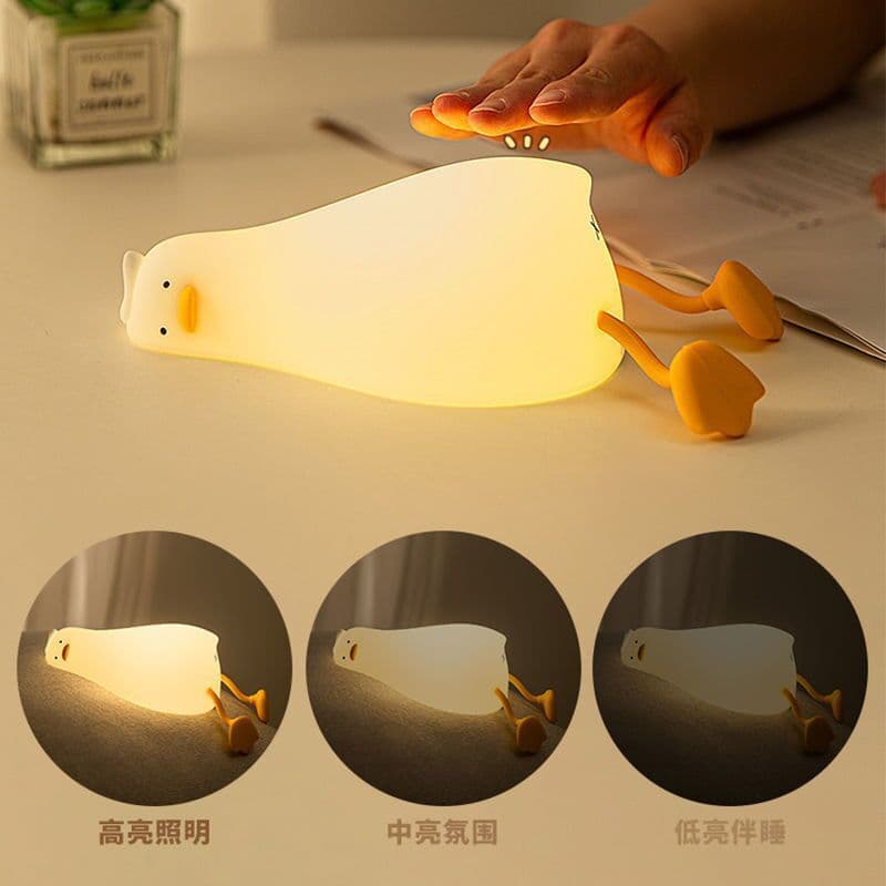 image-Lying Flat Turning Duck Night Light Fun Creative Silicone LED Night Light USB Charging Mobile Phone Holder Gift for Children