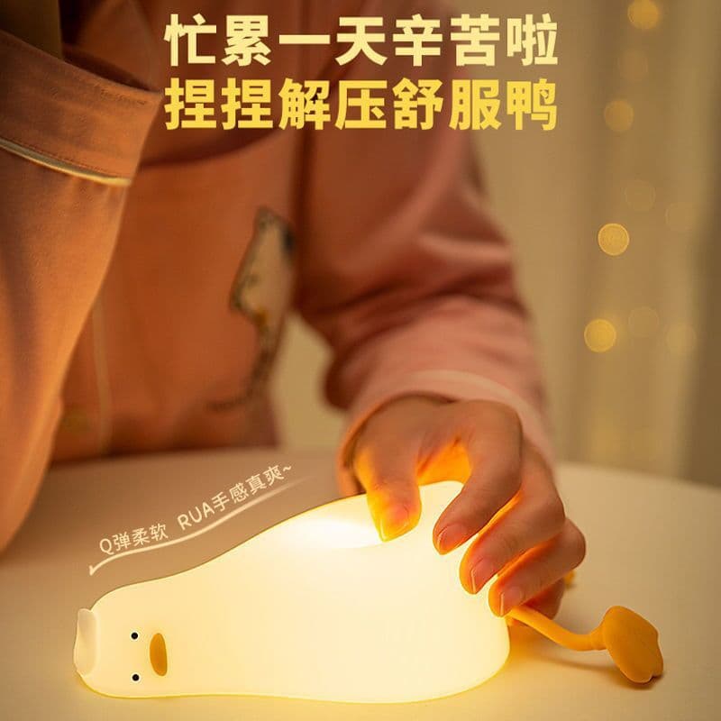 image-Lying Flat Turning Duck Night Light Fun Creative Silicone LED Night Light USB Charging Mobile Phone Holder Gift for Children