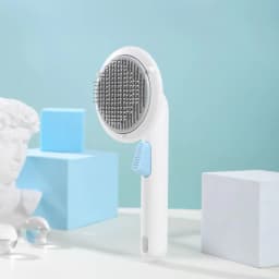 image-UFO Flying Saucer Self-Cleaning Comb for Cat Dog Hair Removal - Pear White