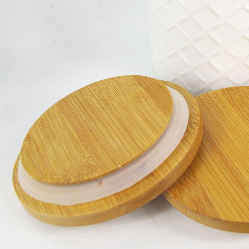 image-Set of Two Ceramic Jars Embossed Cream Canisters with Lids