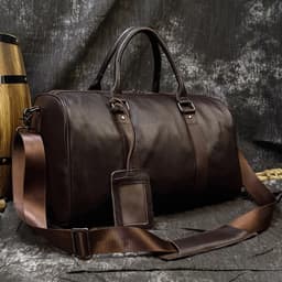 image-Luxury Genuine Leather Men Women Travel Bag Cow Leather Carry On Luggage Bag Travel Shoulder Bag Male Female Weekend Duffle Bag