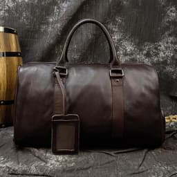 image-Luxury Genuine Leather Men Women Travel Bag Cow Leather Carry On Luggage Bag Travel Shoulder Bag Male Female Weekend Duffle Bag