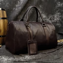 image-Luxury Genuine Leather Men Women Travel Bag Cow Leather Carry On Luggage Bag Travel Shoulder Bag Male Female Weekend Duffle Bag